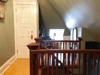 A dormer at the top of the third floor stairs is an enticing spot for the child in all of us.